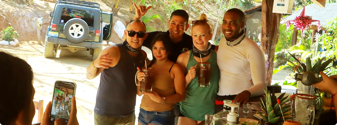 Group posing and giving a thumbs up, enjoying the scenic environment and unique hot springs attractions.
