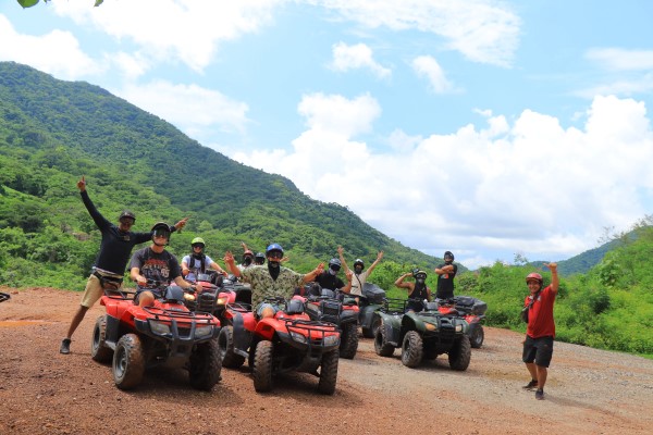 People celebrating on ATVs in Puerto Vallarta, exploring unique things to do in Puerto Vallarta. 
