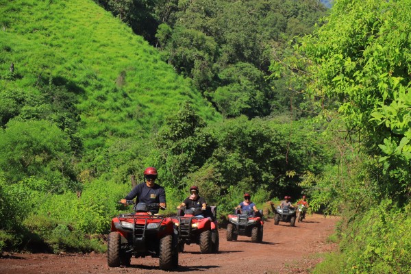 People riding ATVs through the landscapes of Puerto Vallarta; unique things to do in Puerto Vallarta. 