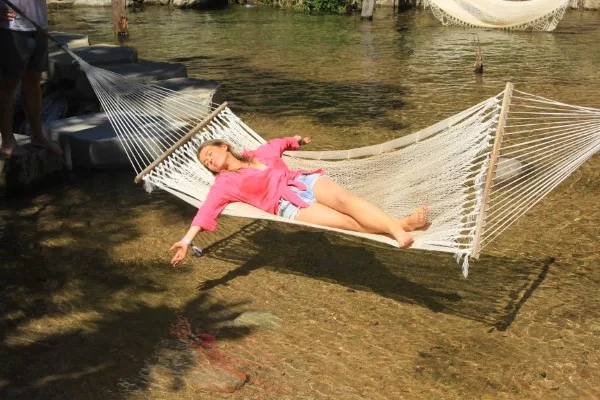 Woman relaxing in a hammock, enjoying the tranquility and unique adventures in Puerto Vallarta.