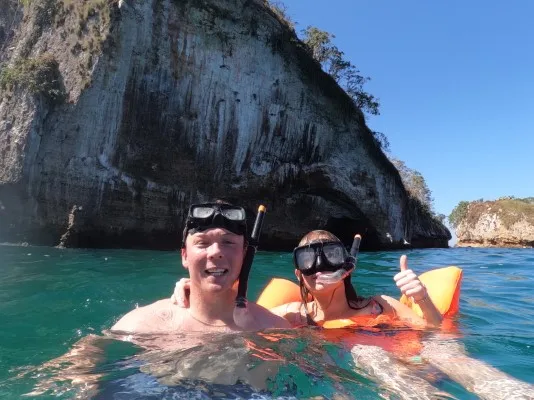 Young people enjoying the sea, having fun in the clear water during their trip, travel to Puerto Vallarta for a perfect beach getaway.