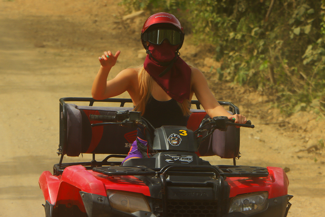 Off-road UTV crossing a river effortlessly, showcasing the power and adventure of a side by side vehicle in nature's challenging terrain.
